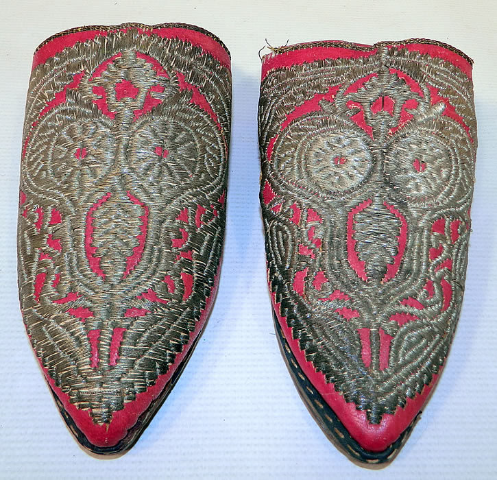 Vintage Moroccan Ladies Mules Cherbil Metal Embroidery Red Leather Slipper Shoes. This pair of vintage Morocco ladies mules cherbil metal embroidery red leather slipper shoes date from the 1920s. They are made of red leather, with hand embroidered gold gilded wire thread embroidery couching needlework.