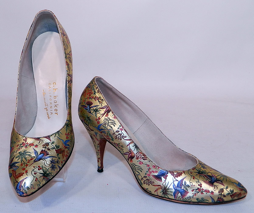 Vintage Galliano Gold Leather Botanical Hummingbird Print Stiletto Heel Shoes. They are made of a gold metallic lam&eacute; leather, with a colorful painted botanical print of plants, flowers and beautiful hummingbirds. 