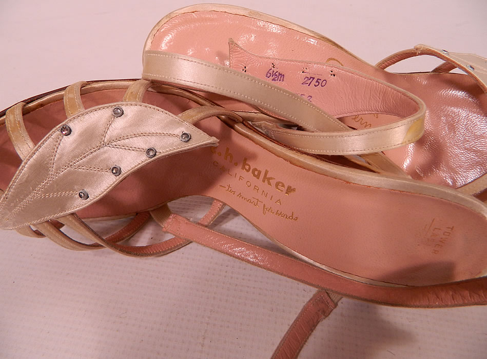 Vintage So Bel Creations by Fern White Satin Rhinestone Leaf Sling Back Sandal Shoes. They have a pink insole lining with a gold embossed label inside "So Bel Creations by Fern", "C.H. Baker California" and are stamped a size 6 1/2 M.