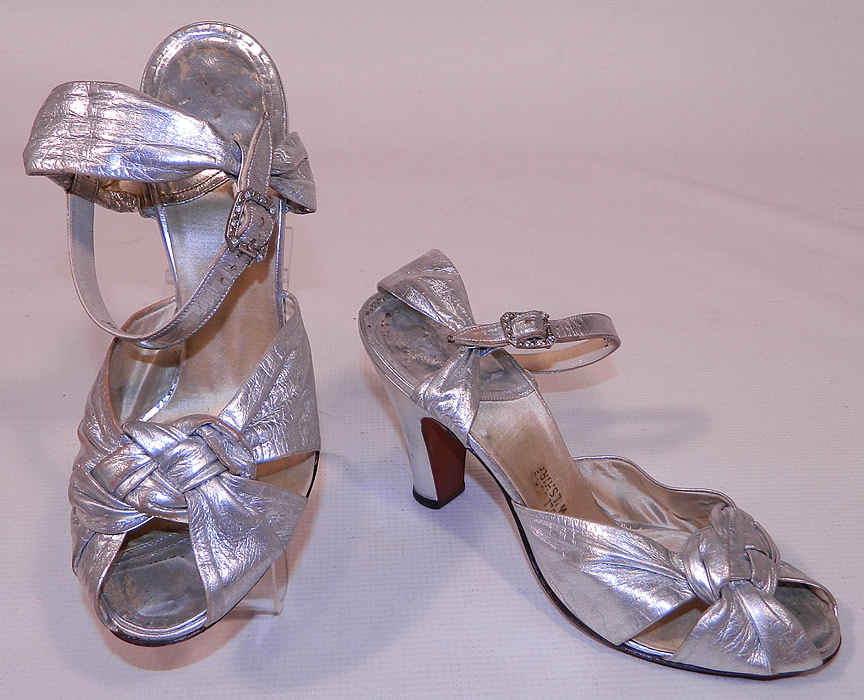 Vintage Bullock's Wilshire Silver Lam&eacute; Lame Leather Ankle Strap Evening Dance Shoes 
This pair of vintage Bullock's Wilshire silver lam&eacute; leather ankle strap evening dance shoes date from the 1930s.They are made of a silver metallic lam&eacute; leather.