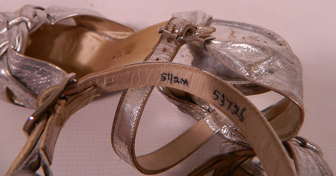 Vintage Bullock's Wilshire Silver Lam&eacute; Lame Leather Ankle Strap Evening Dance Shoes 
The shoes measure 9 inches long, 3 inches wide, with 3 inch high heels and are stamped inside a size 5 1/2 M. 