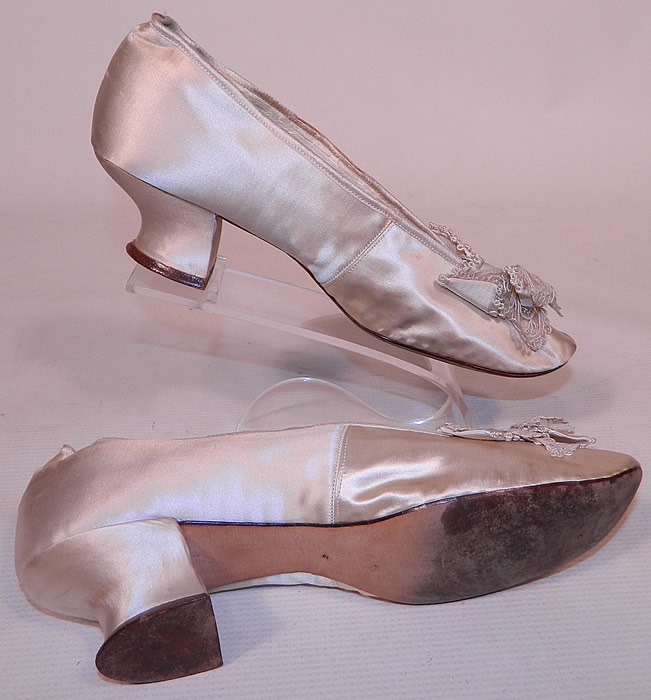 Victorian Joel Swope & Bro. Label White Silk Lace Bow Bridal Wedding Shoes
These beautiful bridal wedding shoes have a slip on slipper style, with rounded toes and satin covered French Louis XV high heels. 