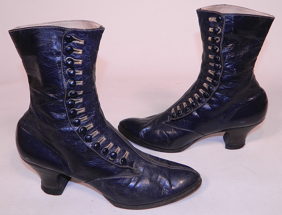 Victorian Women's Navy Blue Leather High Top Button Boots
This pair of antique Victorian era women's navy blue leather high top button boots date from 1890. They are made of a supple dark navy blue leather, with decorative ecru cream color stitching.