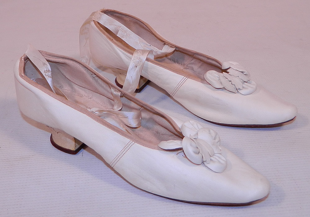 Victorian White Kid Leather Bow Trim Silk Ribbon Ties Wedding Shoes
They are made of a soft white kid leather, with decorative leather bow petal trim on the front instep vamps. 