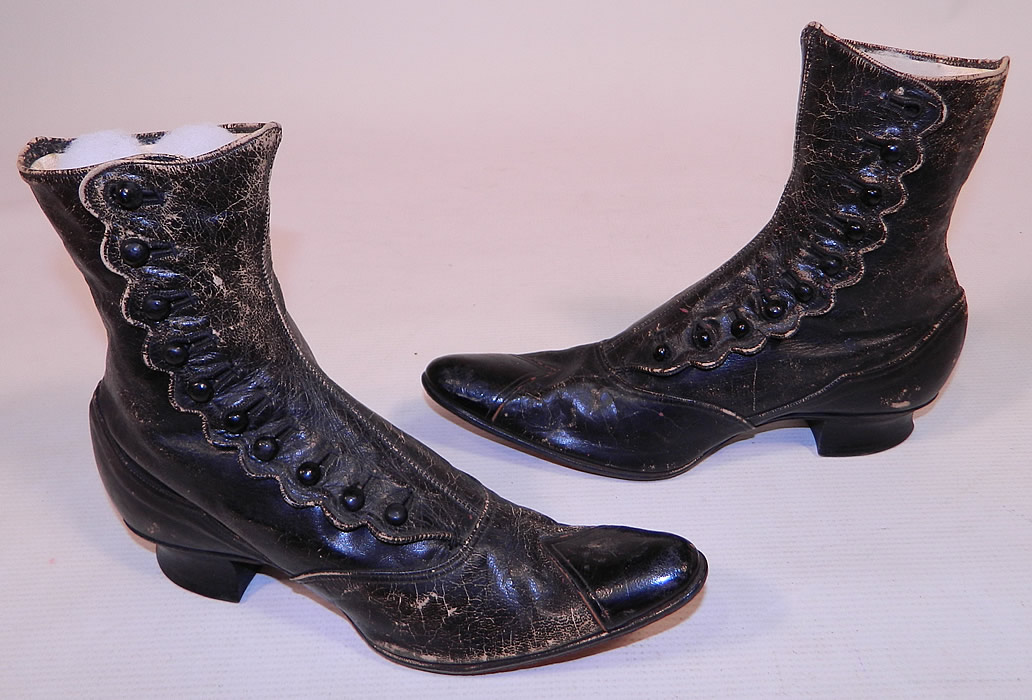 Unworn Victorian Scalloped Side Button Black Leather High Top Boots
This pair of unworn antique Victorian era scalloped side button black leather high top boots date from the 1870s. 