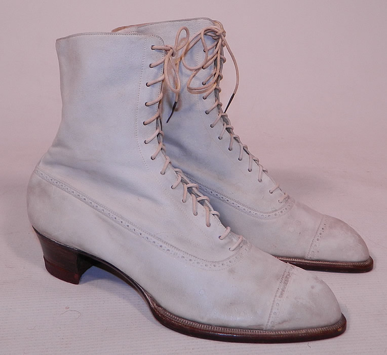 Vintage Nihleen NY Label Victorian White Suede Leather High Top Lace-up Boots
The boots measure 7 1/2 inches tall, 10 inches long, 3 inches wide, with 1 1/2 inch high heels.