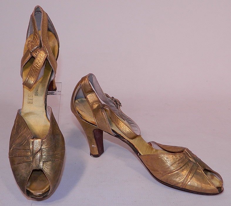 Vintage E.T. Slatter Co. Boston Label Gold Leather Ankle Strap Evening Dance Shoes
This pair of vintage E.T. Slatter Company Boston label gold leather ankle strap evening dance shoes date from the 1930s. They are made of a gold metallic lam&eacute; leather.