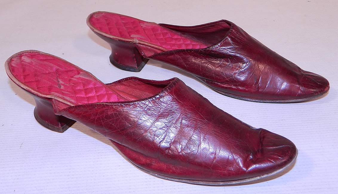 Victorian Womens Red Leather Quilted Silk Lining Backless Mules Slipper Shoes
These radiant red ladies backless mules slip-on slipper style shoes have pointed toes and red leather covered low French Louis XV heels. The shoes measure 8 1/2 inches long and 2 1/2 inches wide. 