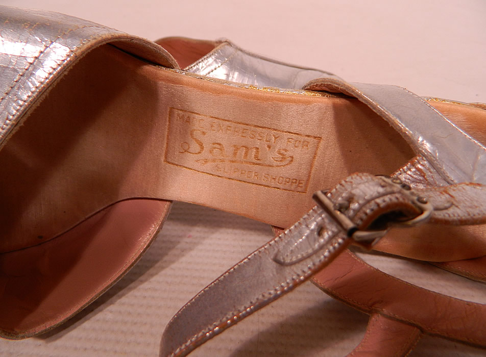 Vintage Sam's Slipper Shoppe Silver Metallic Leather Art Deco Ankle Strap Shoes
The insoles are embossed "Made Expressly For Sam's Slipper Shoppe" label. The shoes measure 9 1/2 inches long, 3 inches wide, with 2 1/2 inch high heels. 