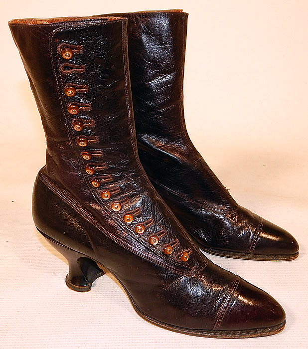 Victorian Women's Antique Bronze Brown Leather High Top Button Boots & Hook
These beautiful boots have pointed toes with decorative punch work designs across the toes, 16 pearled bronze shoe buttons along the side for closure and leather covered spool heels.
