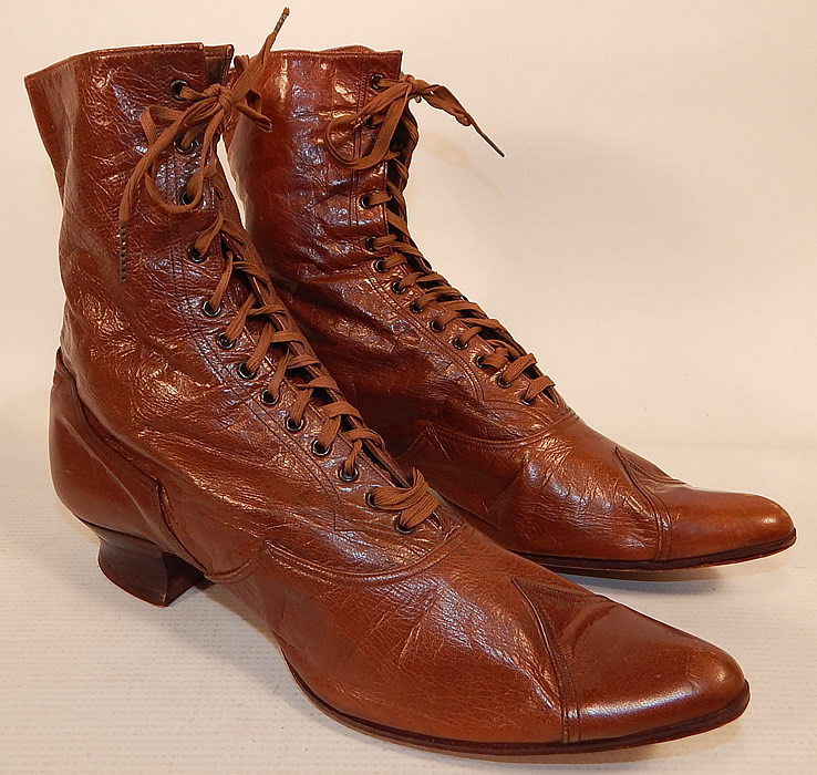 Victorian Antique Womens Brown Leather High Top Lace-up Boots Shoes
The boots measure 7 1/2 inches tall, 10 inches long, 2 1/2 inches wide, with a 1 inch high heel. 