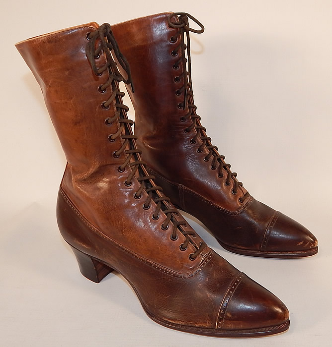 Unworn Victorian Brown Two Tone Leather High Top Lace-up Boots Shoes
These beautiful boots have pointed toes, the original brown shoe string laces for closure and stacked wooden cube heels. The boots measure 10 inches tall, 10 inches long, 2 1/2 inches wide, with 2 inch high heels. 