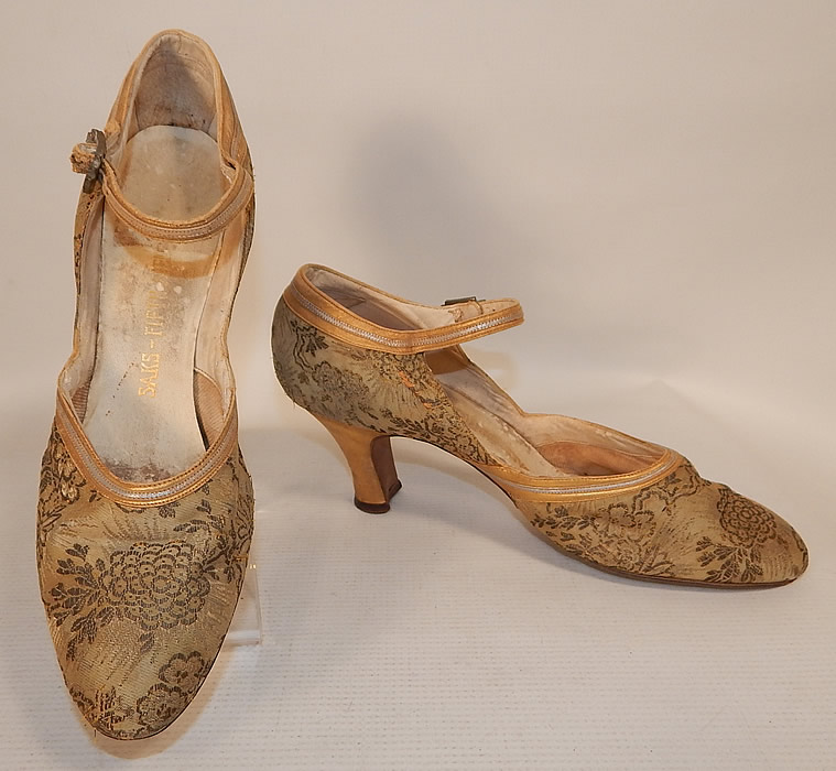 Vintage Saks Fifth Avenue Art Deco Gold Silver Leather Lam&eacute; Lame Brocade Flapper Shoes
They are made of a gold lam&eacute; silk damask weave brocade fabric with a woven floral pattern design and gold, silver metallic leather trim edging. 