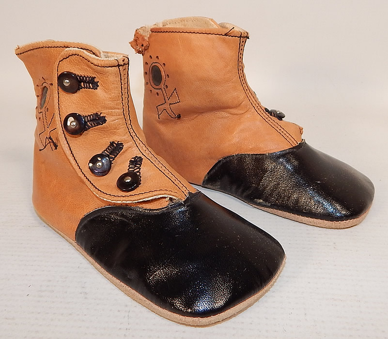 Victorian Peters Sweetheart Tan & Black Leather High Button Baby Boots Childs Shoes
These charming child's high top button baby boots have squared toes, with 4 black shoe buttons down the sides for closure and soft suede leather bottom soles.