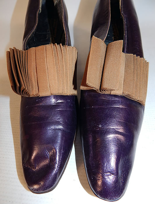Edwardian Vintage Peter Robinson London Label Iridescent Aubergine Leather Shoes
These elegant evening shoes have a slip on slipper style, with exaggerated pointed toes and leather covered cube heels.