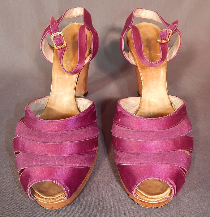 Vintage Purple Silk Satin Ankle Strap Gold Leather Heel Trim Platform Shoes
These elegant evening shoes have adjustable ankle straps, with gold rhinestone buckle closures, peek-a-boo open toes, decorative cut away straps on the instep vamps, a platform lift front and modified boulevard gold leather high heels. 