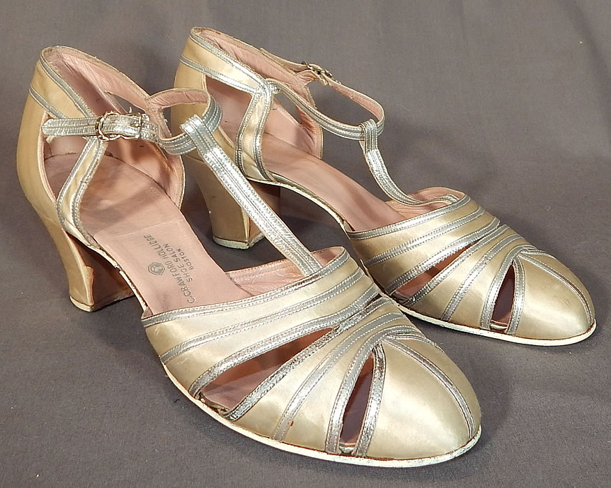 Vintage C. Crawford Hollidge Shoe Salon Cream Silk Satin Silver Leather T-Straps
This pair of vintage C. Crawford Hollidge Shoe Salon cream silk satin silver leather T-straps date from the 1930s. They are made of an off white cream color silk satin fabric, with silver metallic leather trim edging.