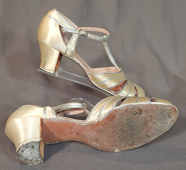 Vintage C. Crawford Hollidge Shoe Salon Cream Silk Satin Silver Leather T-Straps
The shoes measure 9 1/2 inches long, 2 3/4 inches wide, with 2 inch high heels and are stamped inside a size 6 B. They are in good condition, gently worn, with only minor wear and some slight faint scuff marks on the heels. These are truly a wonderful piece of wearable shoe art!
