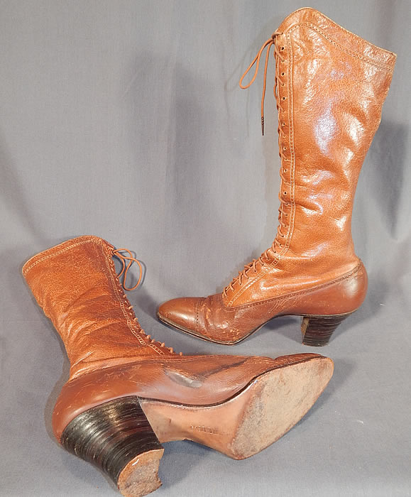 Victorian Vintage I. Miller NY Brown Leather High Top Lace-up Hiking Boots Shoes
These beautiful brown boots are very tall, perhaps using for hiking or riding, with pointed toes, the original brown shoe string laces and stacked wooden cube heels. 