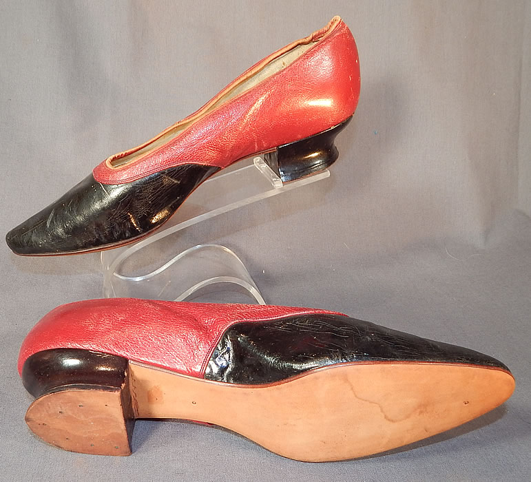 Victorian Red & Black Two Tone Leather Pointed Toe French Heel Slipper Shoes
The shoes measure 9 inches long, 2 1/4 inches wide and have 1 inch high heels. 