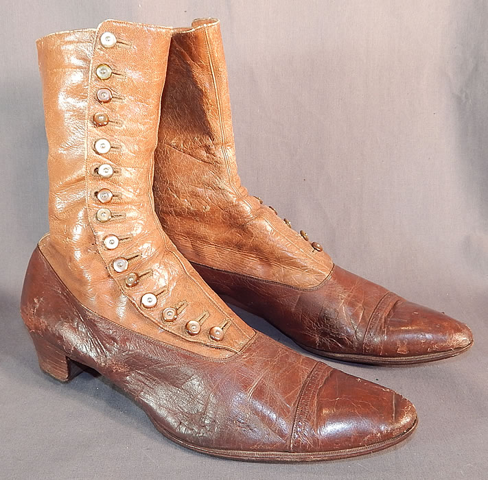 Victorian Antique Brown Two Tone Leather High Top Button Boots Shoes
This pair of antique Victorian era brown two tone leather high top button boots shoes dates from 1900. They are made of a supple two tone brown, and tan color leather. 