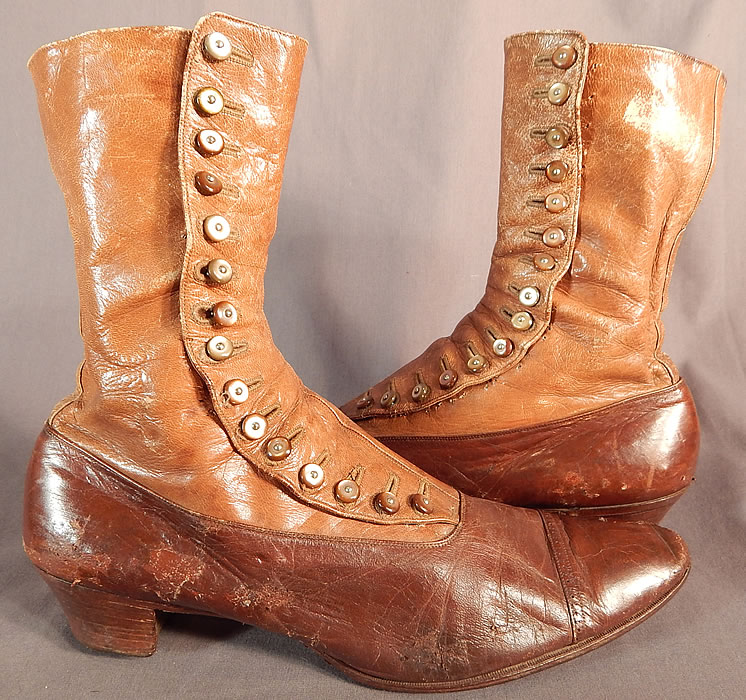 Victorian Antique Brown Two Tone Leather High Top Button Boots Shoes
The boots measure 9 inches tall, 11 inches long, 3 inches wide, with 1 inch high heels and are written inside a size 7 1/2 AA. 