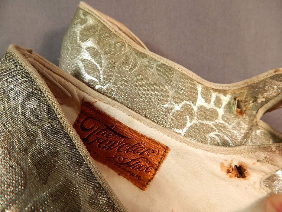 Vintage Traveler Shoe Art Deco Silver Lam&eacute; Lame Brocade Mary Jane Button Strap Shoes
The shoes measure 9 inches long, 2 1/2 inches wide, with 2 inch high heels. 