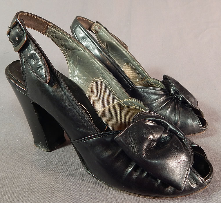 Vintage I. Miller Black Patent Leather Sling Back Peep Toe Pumps Pinup ShoesThis pair of vintage I. Miller black patent leather sling back peep toe pumps pinup shoes date from the 1940s.