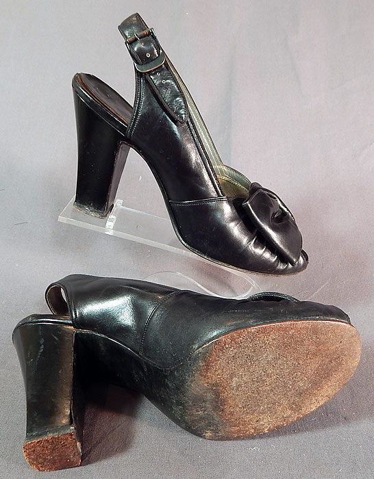 Vintage I. Miller Black Patent Leather Sling Back Peep Toe Pumps Pinup Shoes
The shoes measure 9 inches long, 3 inches wide, with 3 1/2 inch high heels.