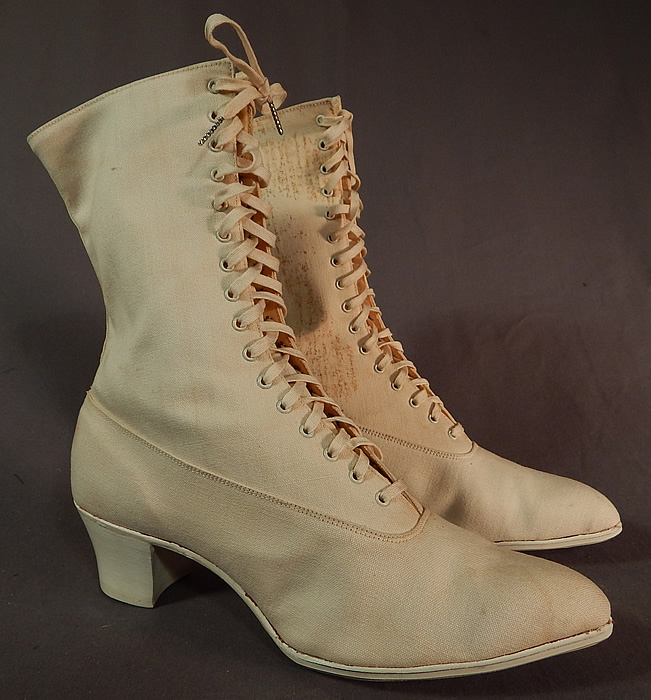 Edwardian Womens White Cotton Canvas High Top Laceup Athletic Boots Sport Shoes
This pair of vintage Edwardian era womens antique white cotton canvas high top lace-up athletic boots dates from 1915. They are made of an off white cream color cotton canvas twill fabric. 