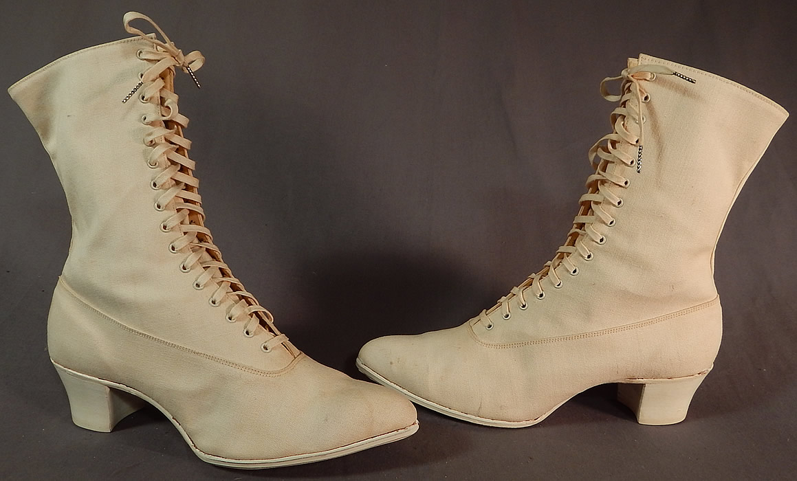 Edwardian Womens White Cotton Canvas High Top Laceup Athletic Boots Sport Shoes
These wonderful womens athletic sport shoes have a bulbous pointed toe, the original shoe string laces for closure, white rubber bottom soles and stacked cube heels. 