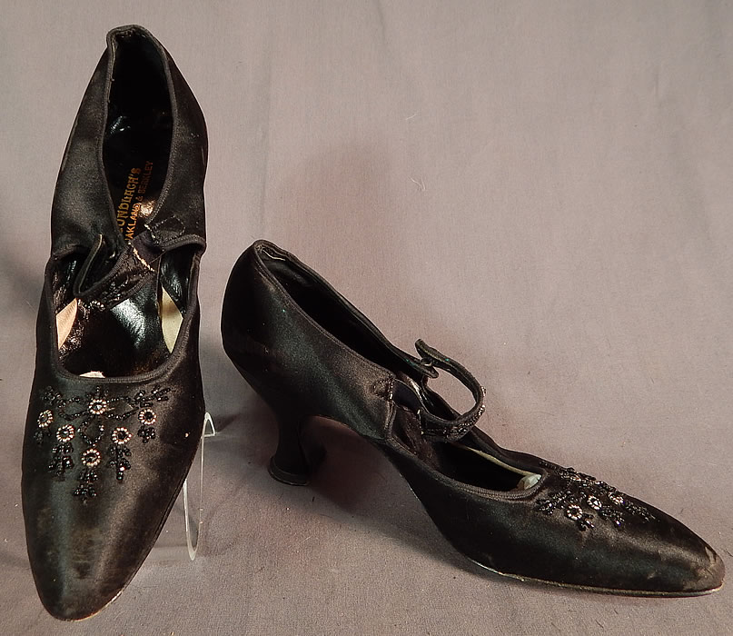 Edwardian Vintage Gundlach's Black Silk Beaded Button Strap Mary Jane Shoes
They are made of a black silk satin fabric with jet, steel cut beadwork on the straps and vamps. 