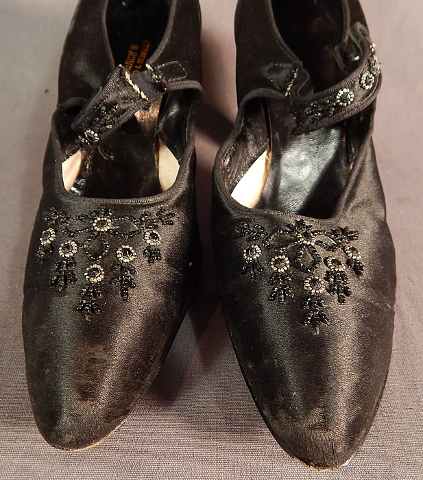 Edwardian Vintage Gundlach's Black Silk Beaded Button Strap Mary Jane Shoes
The shoes measure 9 1/2 inches long, 2 1/2 inches wide, with a 2 1/2 inch high heels. They are approximately a size 5 1/2 or 6 narrow width. 
