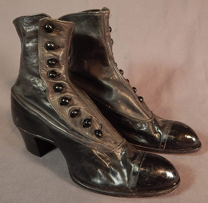 Victorian May Blossom Black Gray Two Tone Leather High Top Button Boots Shoes
This pair of antique Victorian era vintage May Blossom black, gray two tone leather high top button boots shoes dates from 1900. They are made of a supple two tone dark gray upper boot and black patent leather bottom shoe. 