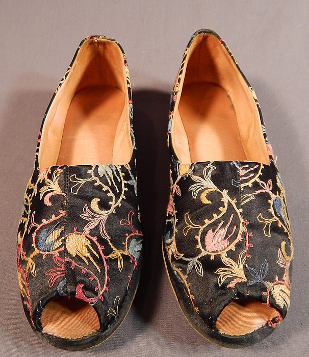 Vintage Black Silk Satin Colorful Tambour Embroidery Boteh Paisley Slipper Shoes
This pair of vintage black silk satin colorful tambour embroidery boteh paisley slipper shoes date from the 1940s. They are made of a black silk satin fabric, with colorful tambour embroidery work done in a boteh paisley pattern design. 