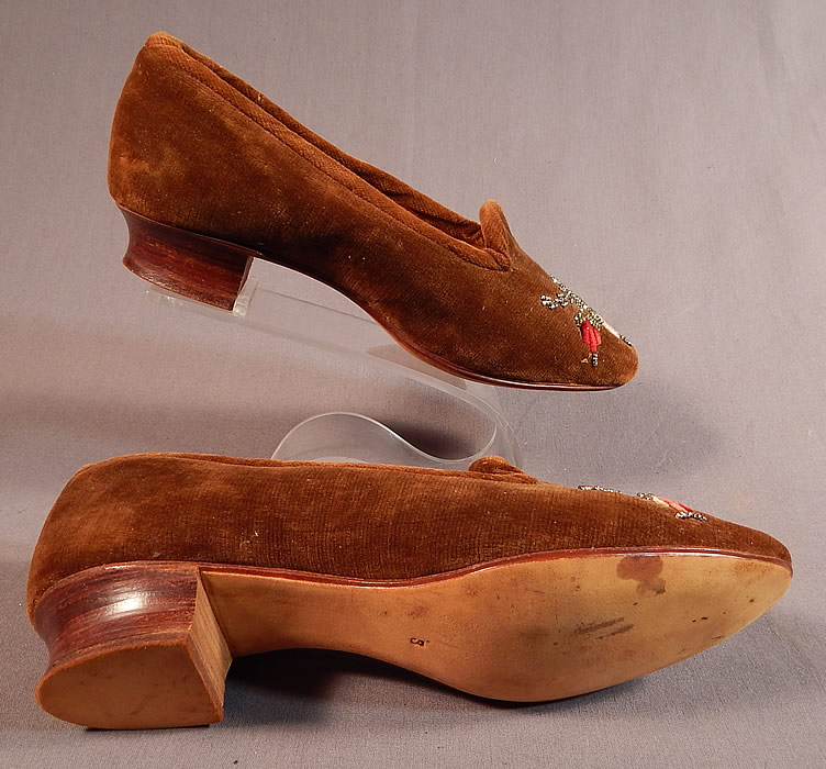 Victorian Brown Velvet Chenille Embroidered Steel Cut Beaded Slipper Shoes
The shoes measure 9 inches long, 2 1/2 inches wide and are stamped on the bottom leather soles size 3.