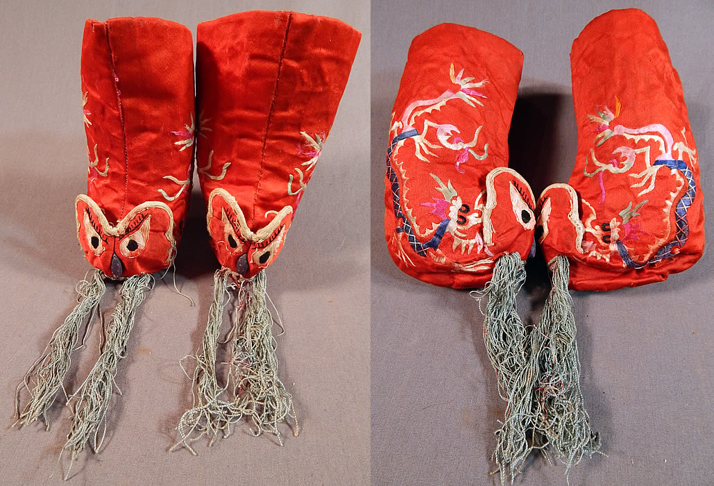 Antique Chinese Child's Red Silk Embroidered Dragon Baby Booties Boots Shoes
This pair of vintage antique Chinese child's red silk embroidered dragon baby booties boots shoes date from the 1920s. They are made of a red silk fabric, with colorful hand embroidery work of dragons along the sides and creating a cute three dimensional animal face on the fronts with long blue silk fringe whiskers. 
