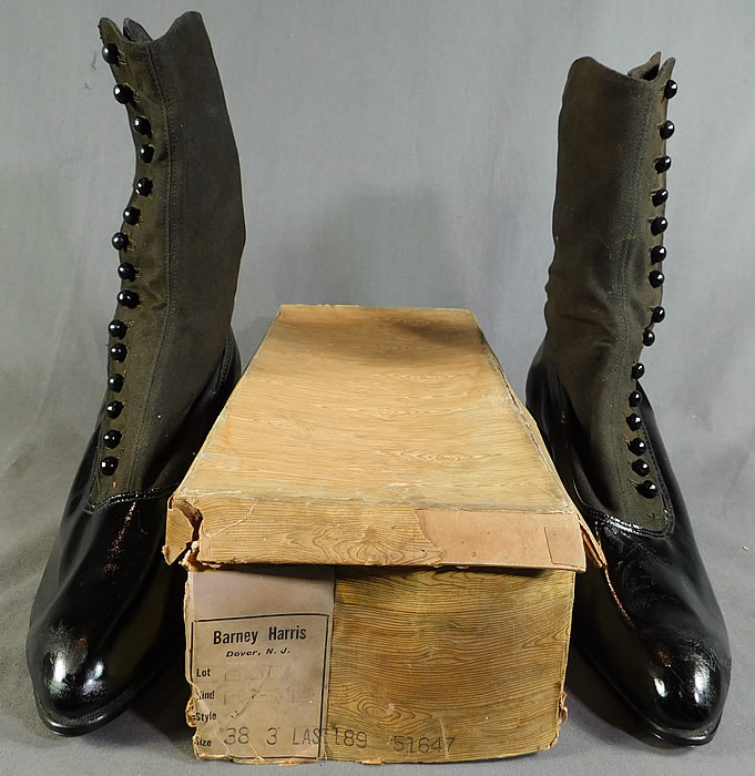 Edwardian Unworn Womens Black Wool Patent Leather High Top Button Boots
This pair of antique Edwardian era unworn womens black wool and patent leather high top button boots date from 1910. They are made of a black patent leather bottom shoe, with a black wool fabric top. 