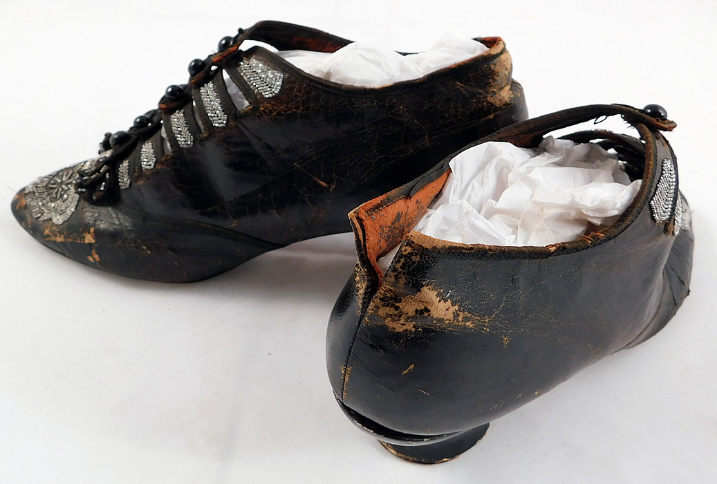 Victorian Antique Brown Leather Steel Cut Beaded 5 Button Strap Shoes
They are in poor as-is condition, wear, cracking, peeling of the leather in areas, a frayed tear on the back of one heel, a few tiny frays on the silk bow trim and there are some missing beads (see close-ups). These are truly a rare and beautiful quality made antique shoe which would be great for display! 