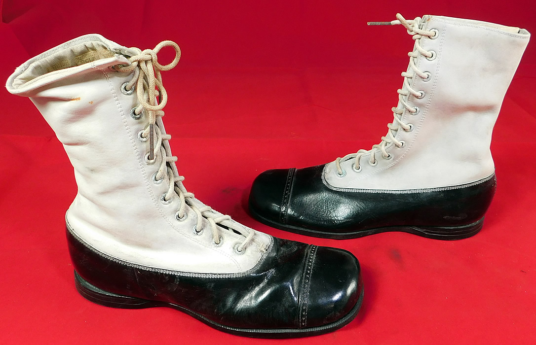 Unworn Vintage Doctor Deans Edwardian Two Tone Black & White Leather High Top Boots
The boots measure 6 1/2 inches tall, 7 1/2 inches long, 2 1/2 inches wide and a 1/2 inch high heel. 