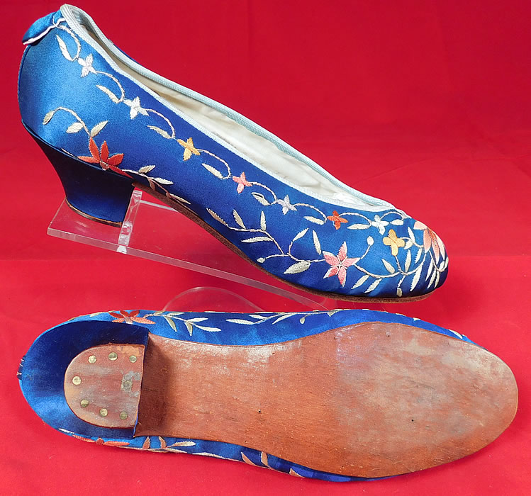 Antique Chinese Blue Silk Colorful Floral Lotus Embroidered Heel Shoes
They appear to have never been worn and are in excellent wearable condition. These are truly a wonderful piece of antique Chinese wearable shoe art! 