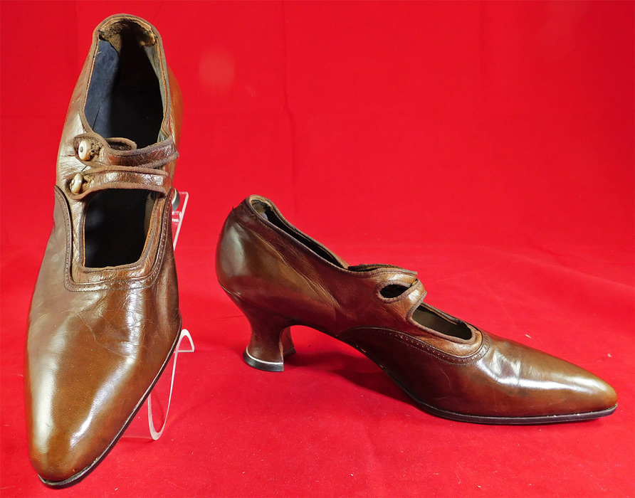 Unworn Edwardian Two Tone Tan Leather Oxford Button Strap Shoes & Box
hey come in the original shoe box covered with a wonderful spider web cobweb graphics foil paper from "The Harris Shoe Store" in Dover, New Jersey and are stamped on the outside of the box a size 36. The shoes measure 10 inches long, 3 inches wide, with a 2 inch high heel. These antique shoes are difficult to size for today's foot, but my guess would be about a US size 6 or 7 narrow width.