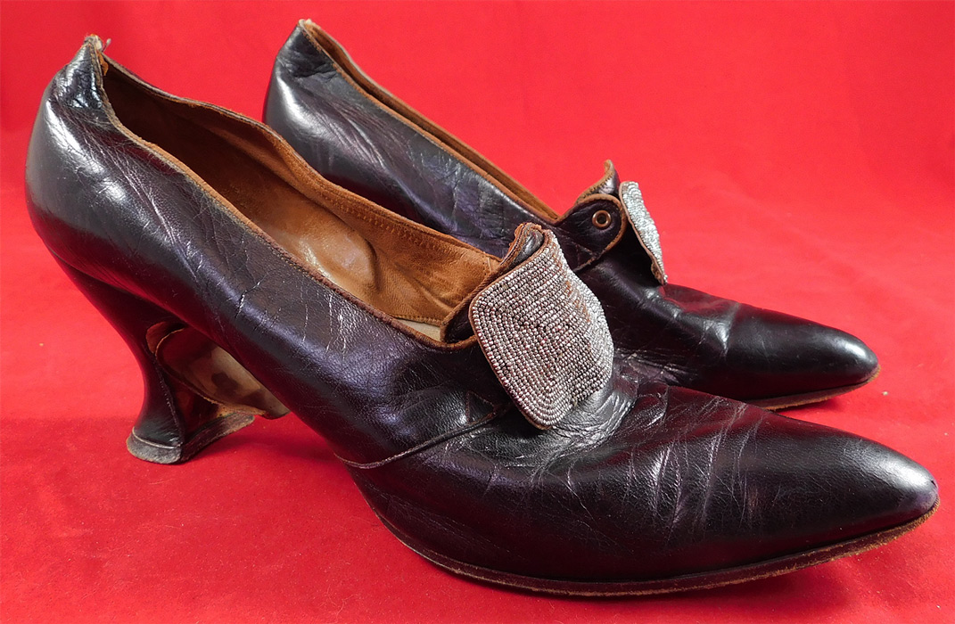 Edwardian Aubergine Leather Steel Cut Beaded Buckle Pointed Toe Shoes
They are made of a dark purplish brown aubergine eggplant color leather, with steel cut beaded buckle trim on the front instep vamps. 