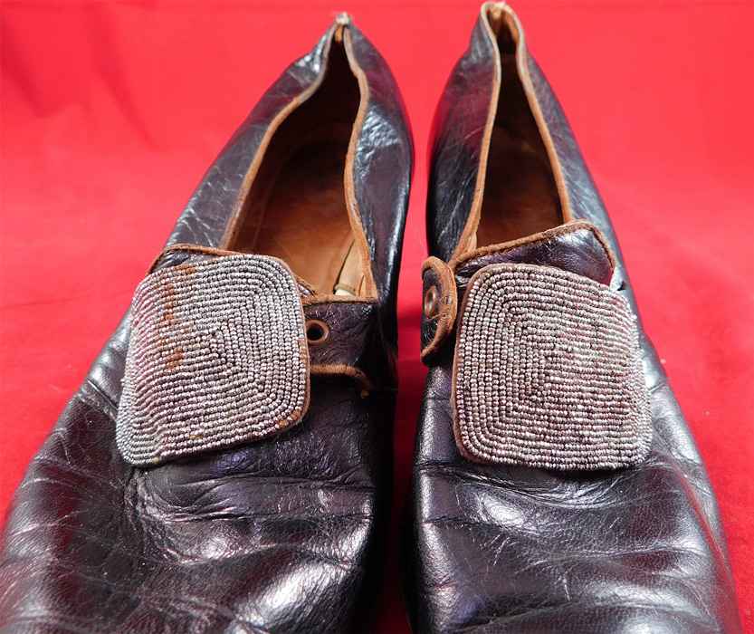 Edwardian Aubergine Leather Steel Cut Beaded Buckle Pointed Toe Shoes
This pair of antique Edwardian era aubergine leather steel cut beaded buckle pointed toe shoes date from 1910. 
