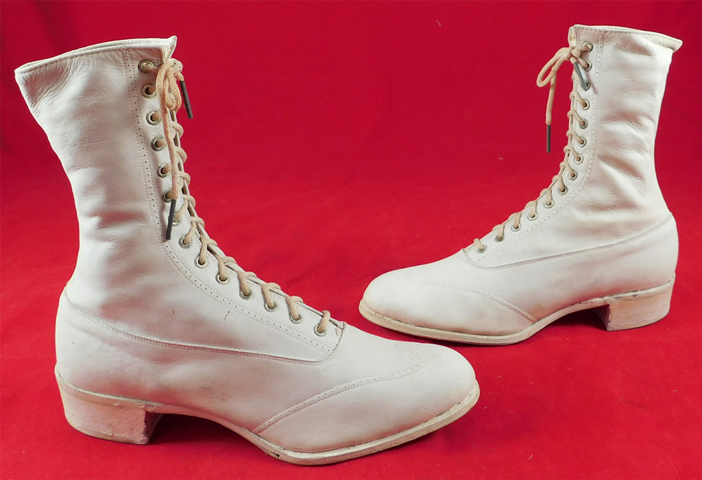 Unworn Edwardian White Leather High Top Rubber Sole Sneaker Boots Shoes
These youths early Keds style sneakers athletic sportswear shoe have a high top boot style with the original white shoe string laces for closure, pointed toes and low rubber cube heels. The boots measure 7 1/2 inches tall, 8 1/2 inches long, 2 1/2 inches wide, with a 1 inch high heel.