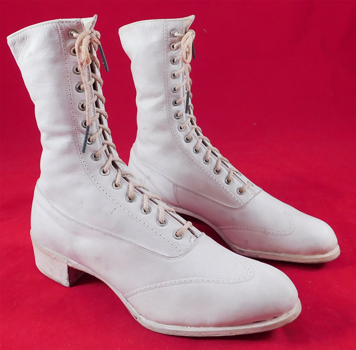 Unworn Edwardian White Leather High Top Rubber Sole Sneaker Boots Shoes
They are made of white leather with rubber soles and heels.