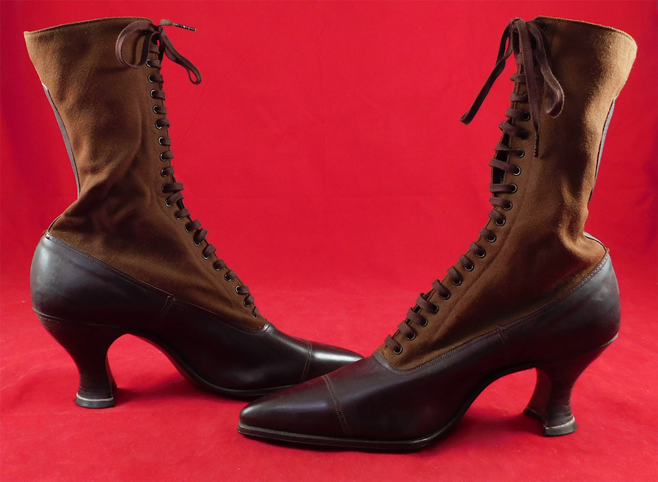 Unworn Edwardian Two Tone Brown High Top Laceup Cloth Boots & Shoe Box
This pair of unworn antique Edwardian era two tone brown high top laceup cloth boots and shoe box dates from 1910. They are made of a two tone chocolate brown color cloth wool top and dark brown leather bottom shoe with decorative punchwork designs. These beautiful boots have a two tone color combo, with pointed toes, the original brown shoe string laces for closure, stacked wooden French spool heels and are embossed stamped inside "Harris Shoe Store Dover, N.J.". 