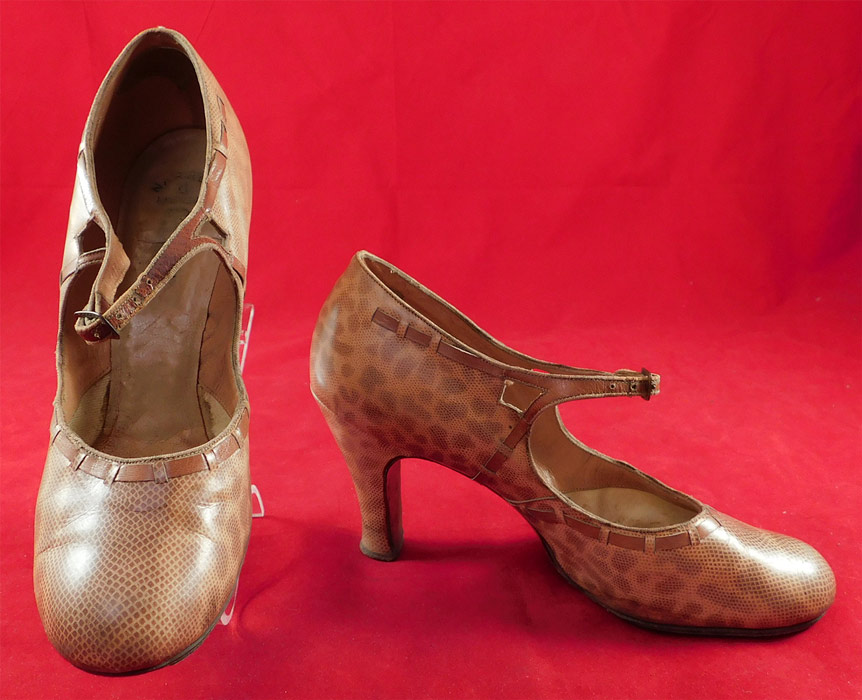 Vintage Art Deco Spotted Snakeskin Print Leather Mary Jane Buckle Strap Shoes
This pair of vintage Art Deco spotted snakeskin print leather Mary Jane buckle strap shoes date from the 1930s. They are made of a two tone tan leather with a spotted faux snakeskin embossed print pattern and leather trim edging woven through. 