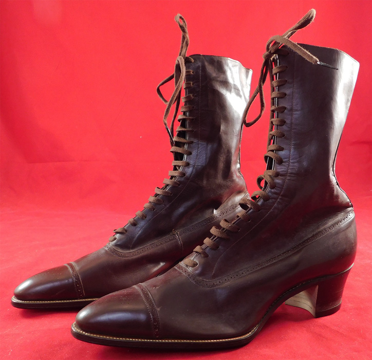 Unworn Vintage Edwardian Dark Brown Leather High Top Lace-up Boots & Box
These beautiful brown boots have the original brown shoe string laces for closure, pointed toes and stacked wooden cube heels. They come in the original shoe box covered with a wood grain graphics paper from "The Harris Shoe Store" in Dover, New Jersey and are stamped on the outside of the box a size 265, but are stamped inside the shoe a size 38. The boots measure 10 inches tall, 10 inches long, 3 inches wide, with 2 1/2 inch high heels. 
