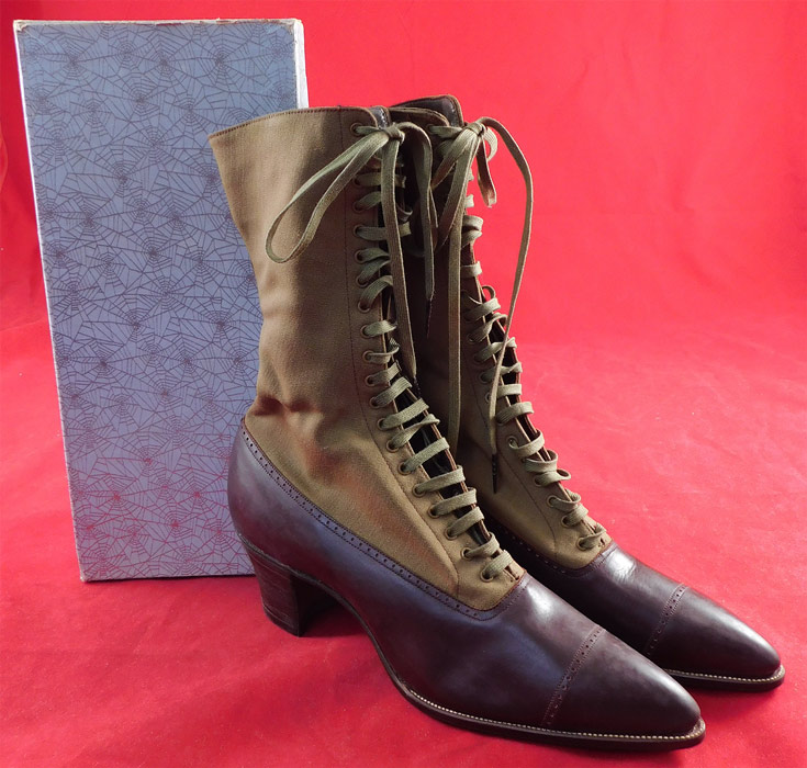 Unworn Edwardian Two Tone Khaki Brown High Top Laceup Cloth Leather Boots & Shoe Box
This pair of unworn antique Edwardian era two tone khaki brown high top laceup cloth leather boots and shoe box date from 1910. They are made of a two tone khaki color cloth wool top and dark brown leather bottom shoe with decorative punchwork designs. 
